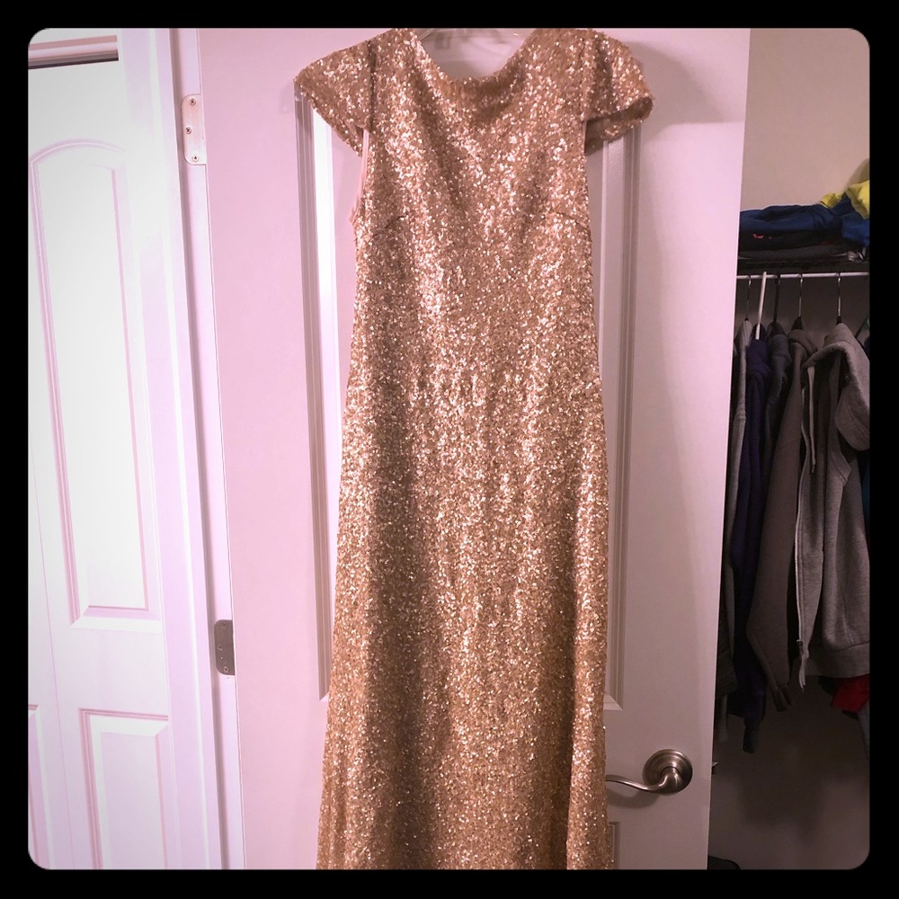 Long, open back, sequined bridesmaid dress.
